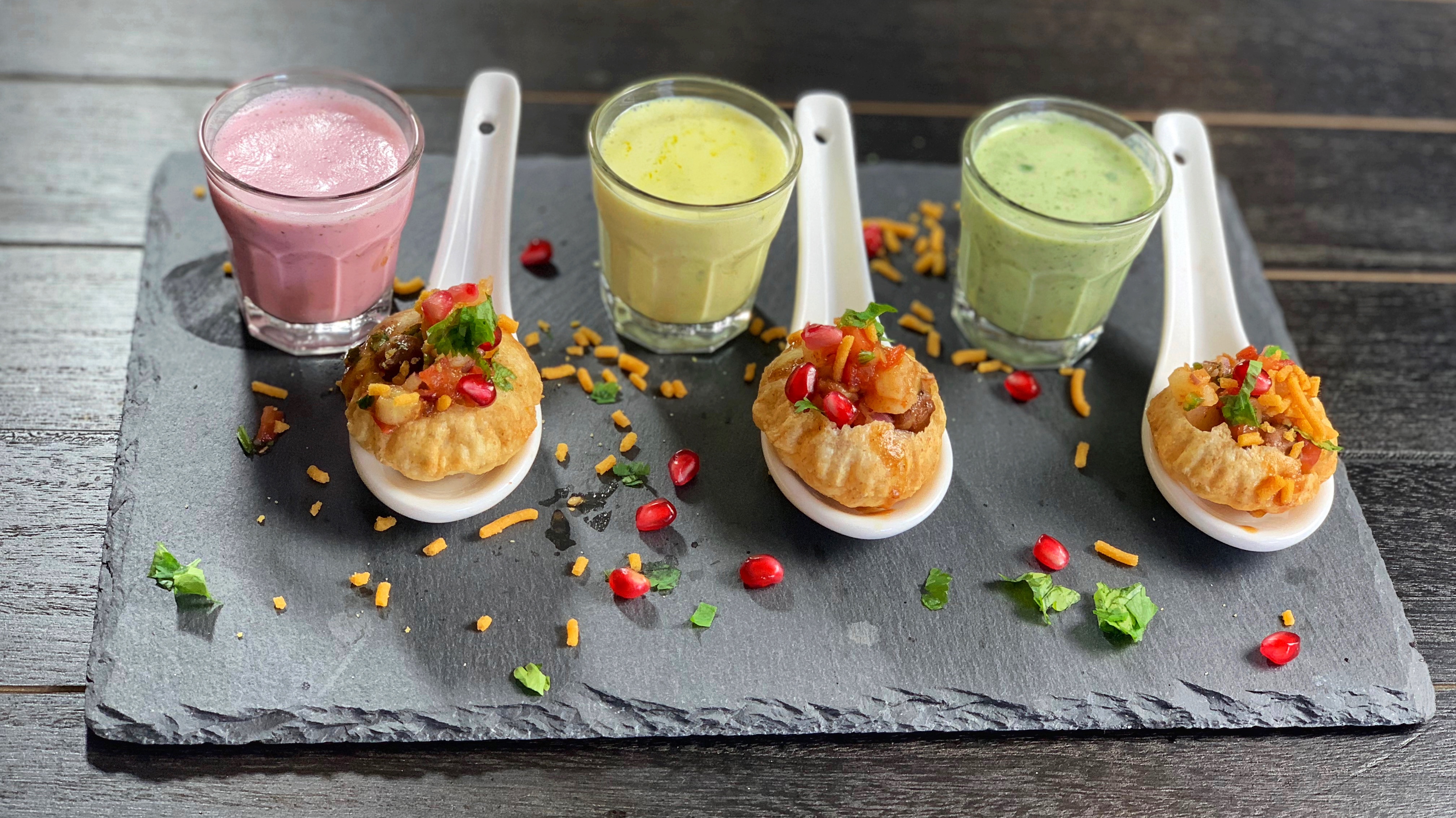Rainbow Dahi Shots - a festive twist on the classic Indian street and comfort food, this version of panipuri, drenched with yogurt based pani and stuffed with tangy masala is the perfect blend between colors and flavors!
