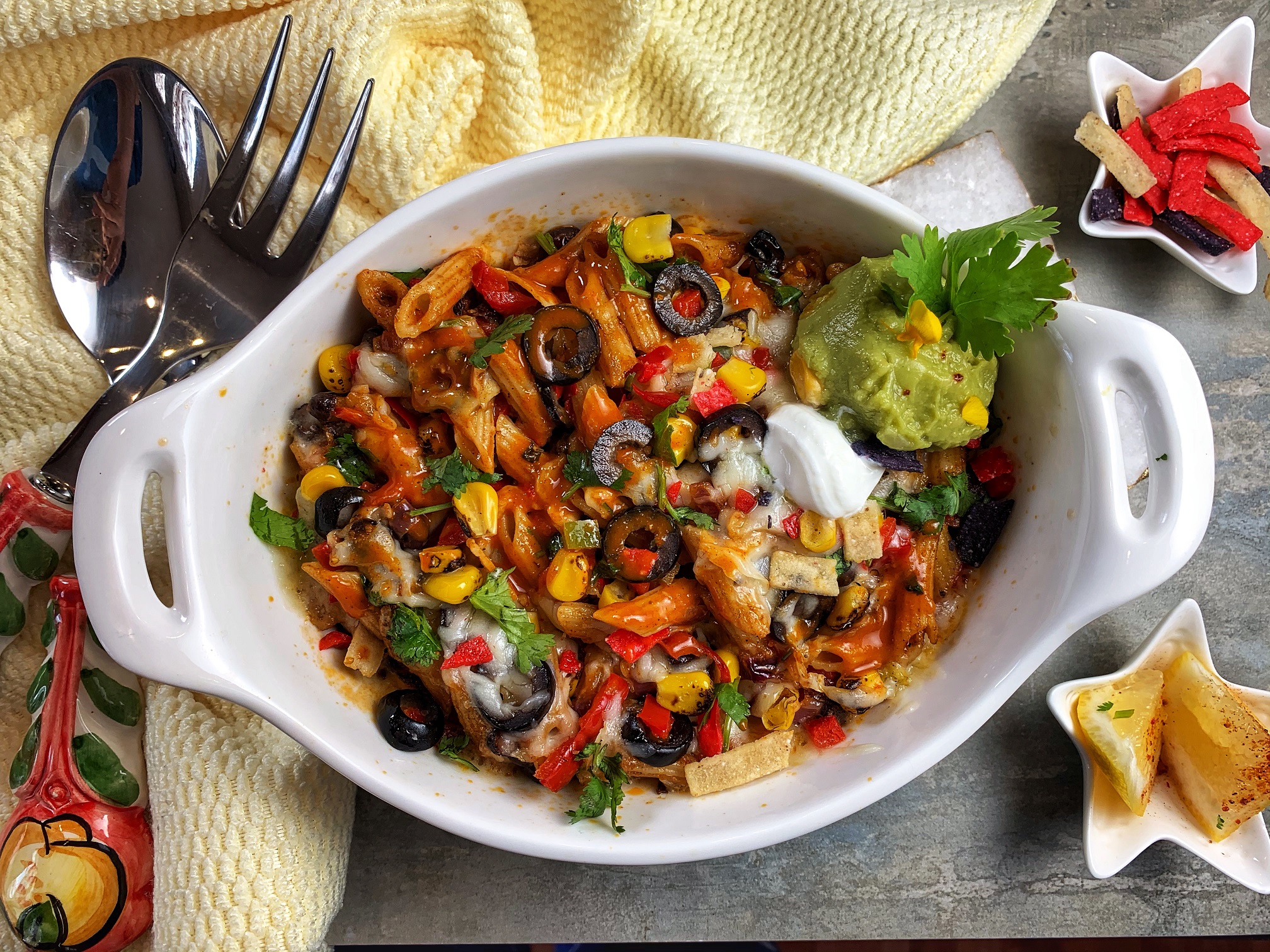 Enchilada Pasta Bake - dotted with colorful veggies, velvety pockets of cheese, and an array of vibrant spices, this baked vegetarian Mexican Pasta is the fusion dish of your dreams! There’s no better way to spice up a pasta dish than adding in some homemade enchilada sauce for a fun twist!