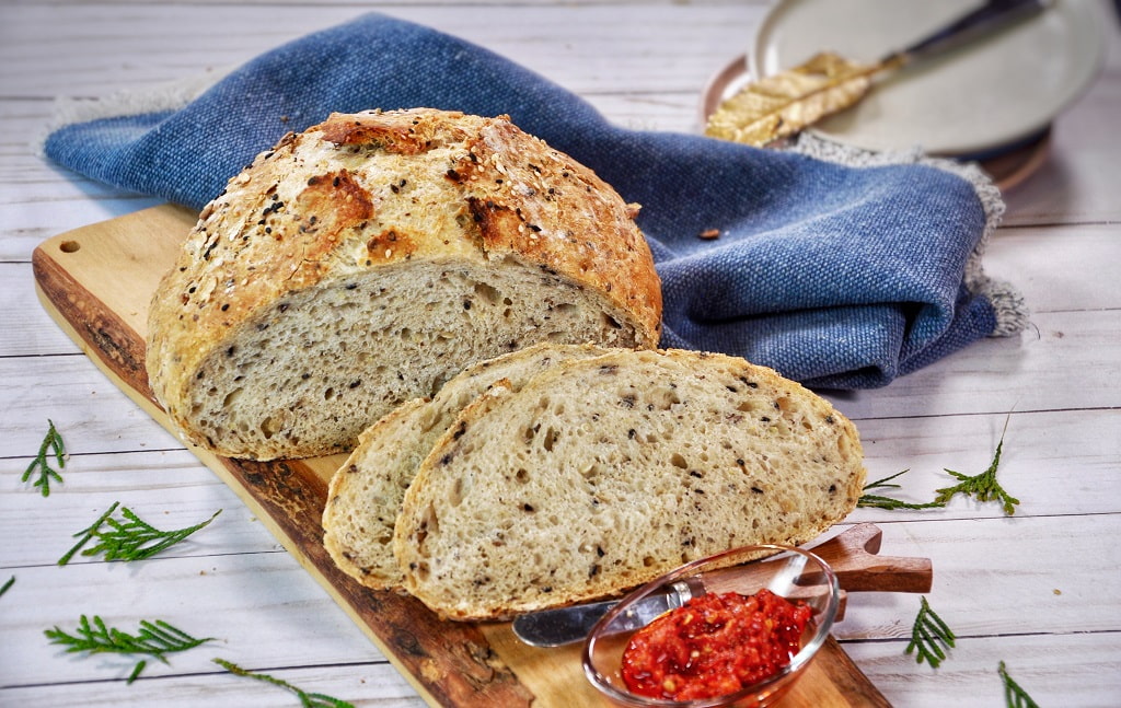 No Knead Multiseed Bread - easy to make, nutritious bread that requires no kneading. With a moist interior, crunch from the seeds (flax, chia, hemp, sesame), and lots of fiber, try this homemade dutch oven bread.