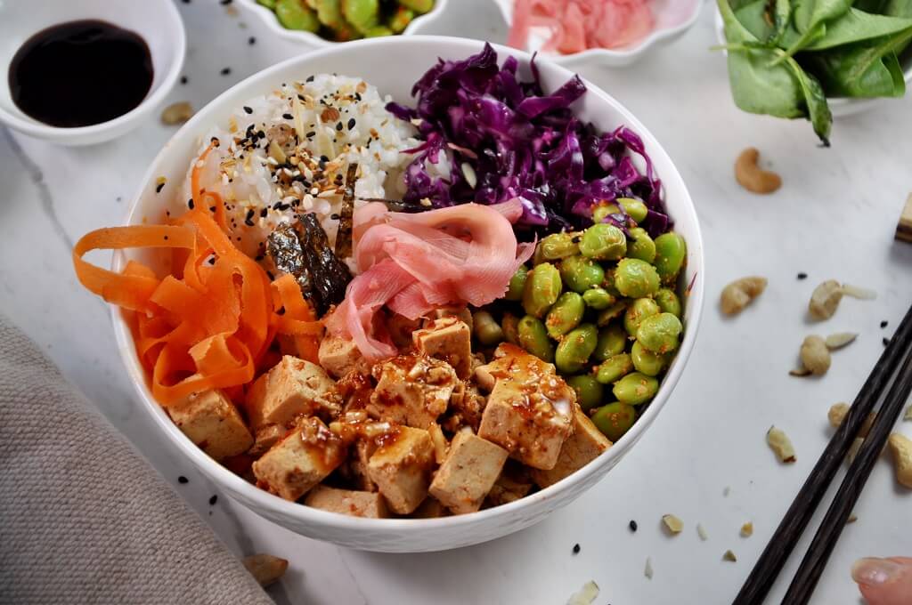 With sesame-ginger tofu, spicy edamame, and pickled ginger, this Tofu Poke Bowl is a total game changer! Requiring no cooking whatsoever, taste the tropical flavors of Hawaii with this super simple recipe!