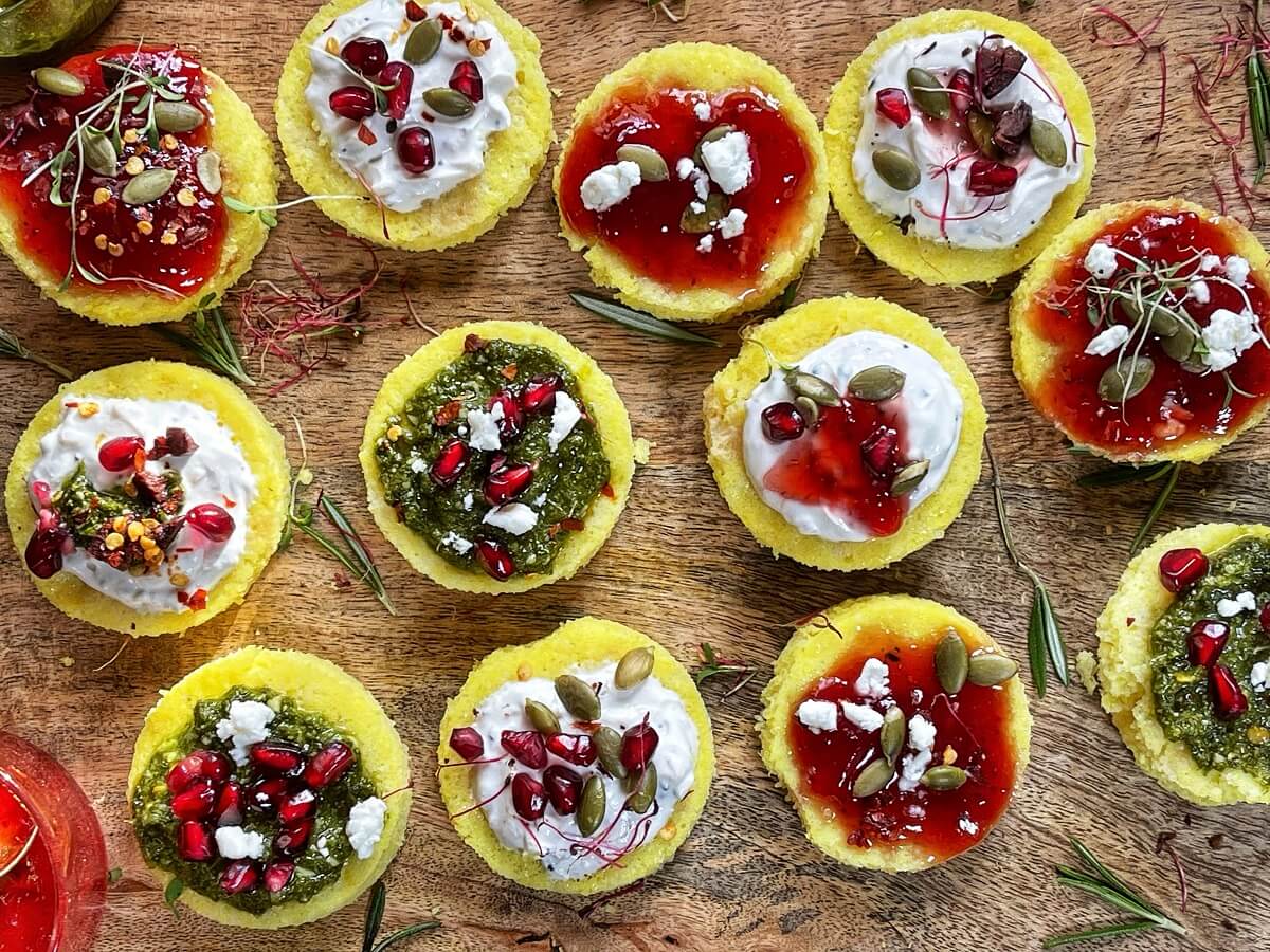 Moong Dal Dhokla Bites with Strawberry Chili Compote, Chimichurri Sauce and Herbed Yogurt - Jazz up this humble Indian classic with some homemade sauces and toppings for a festive Christmas appetizer!